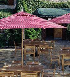 8 foot wood market umbrellas with teak chairs and teak chairs in outdoor restaurant patio setting