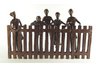 Children Peeking on Fence Sculpture